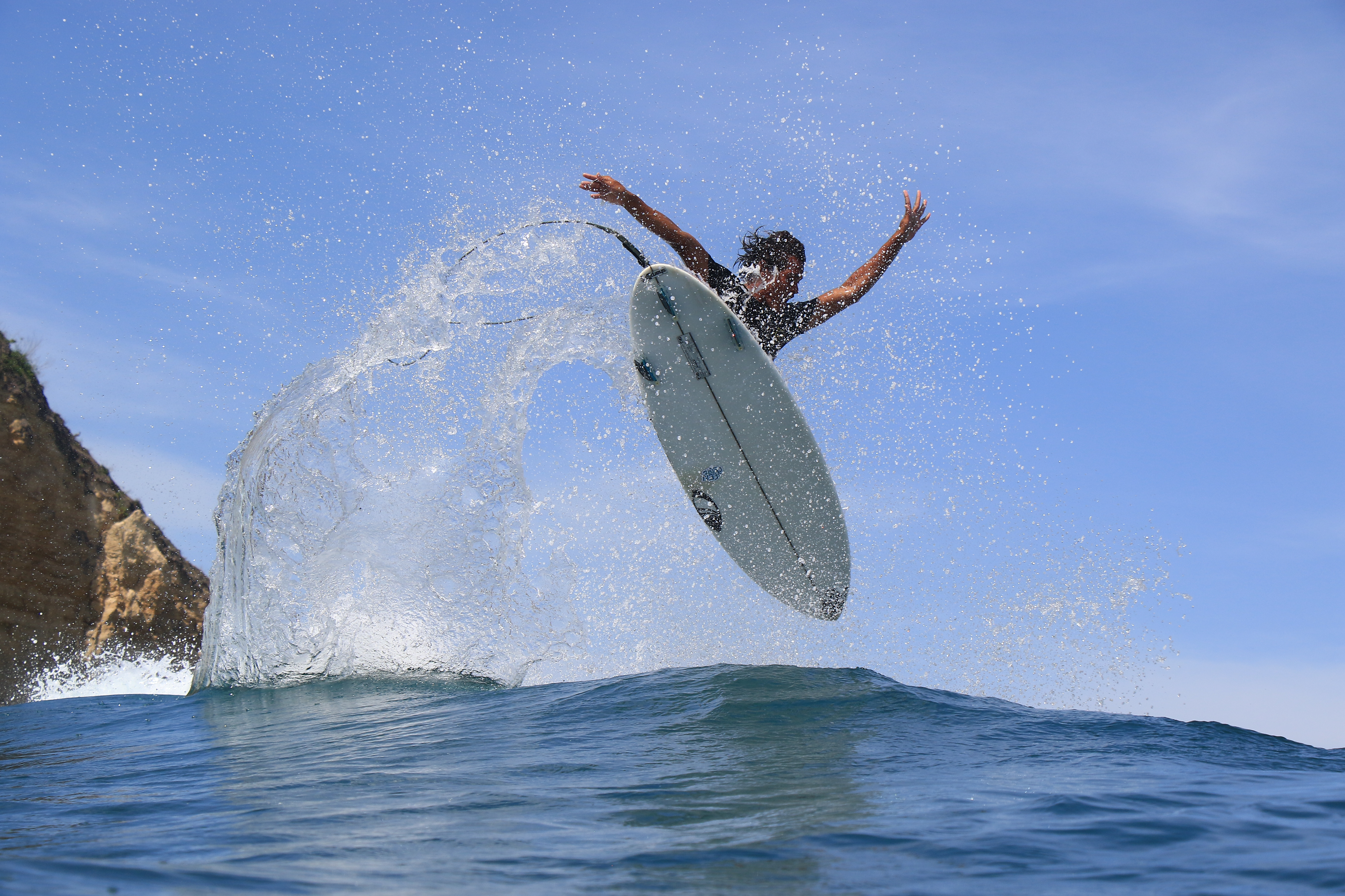 Hoza launching an aerial off a Lombok reef break
